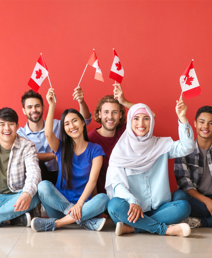 People holding the Canadian flag, celebrating unity in Canada.